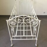 White wrought iron folding bed