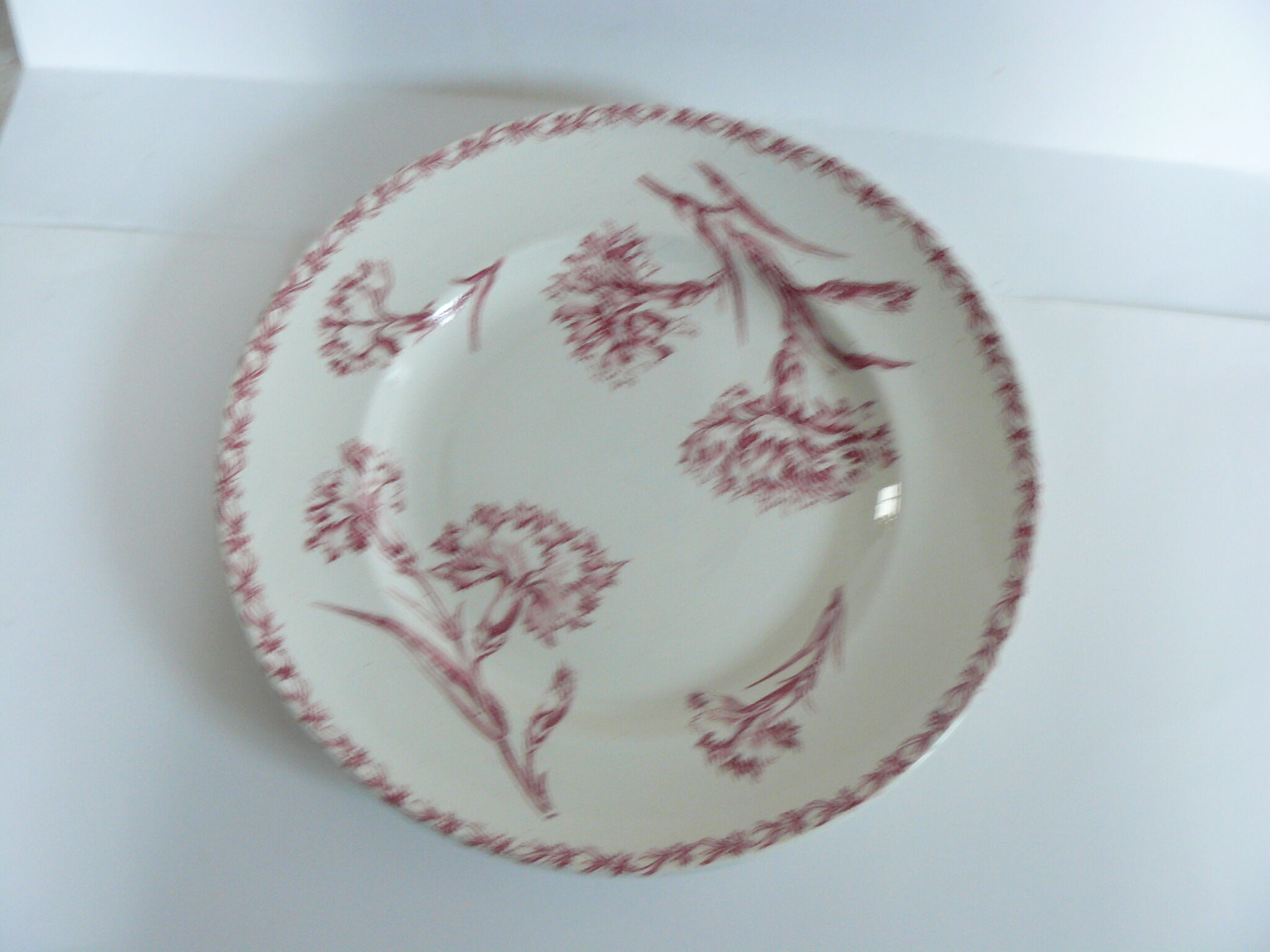 Round plate iron earth model "carnation" of Lunéville