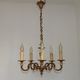 Vintage French traditional style bronze chandelier with 5 lights featuring acanthus leaf details.