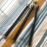 2 small side tables in glass and Bakelite with gold nuts from the 1960s.