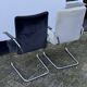 Paire de fauteuils en acier tubulaire