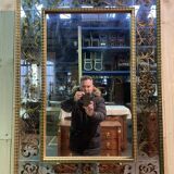 Venetian mirror in eglomise glass and gilded wood