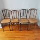 4 mismatched antique bistro chairs in wood and caning
