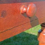 Antique solid wood table with a through drawer.