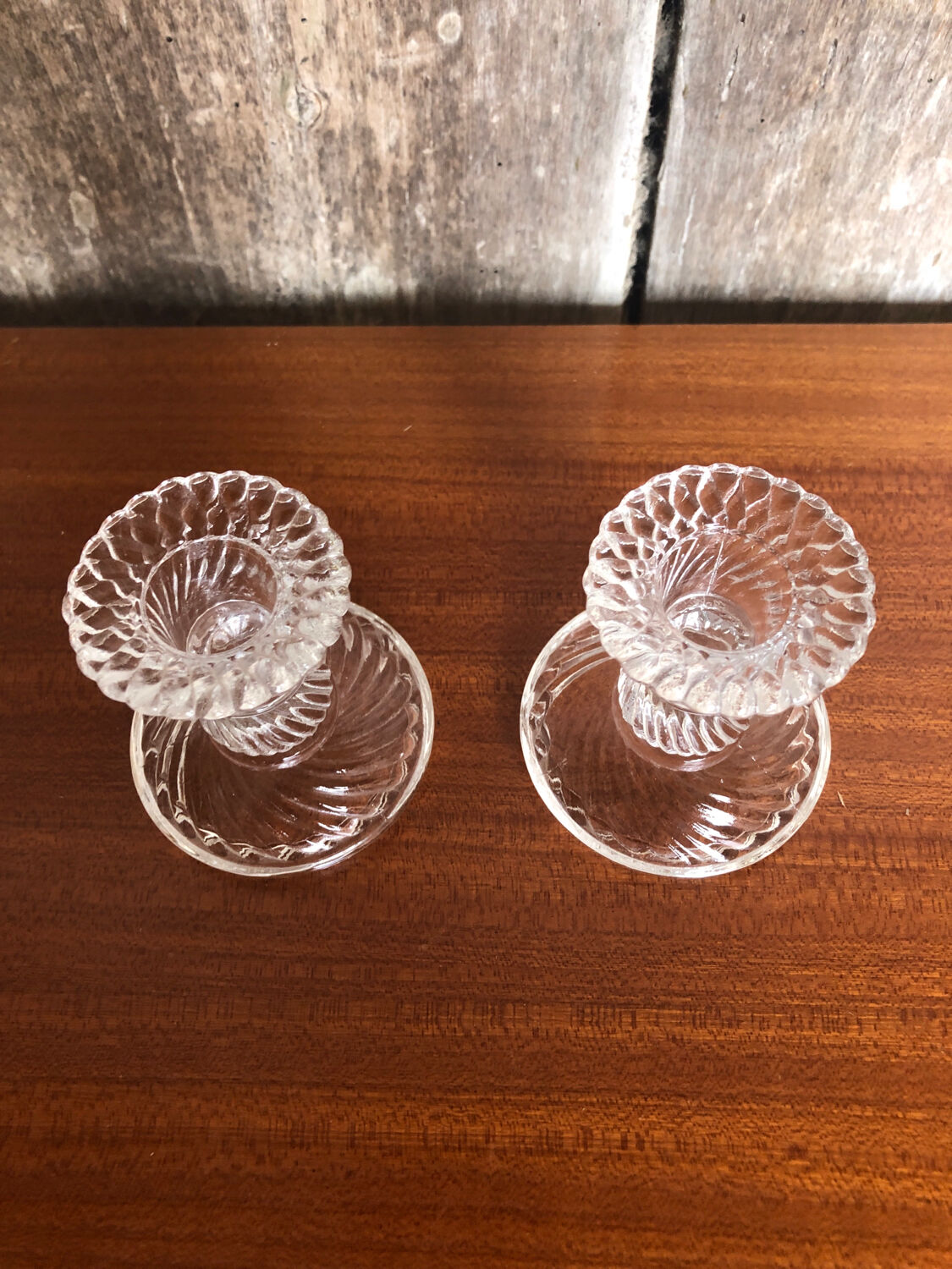 Old pair of vintage round molded glass candle holder