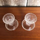 Old pair of vintage round molded glass candle holder