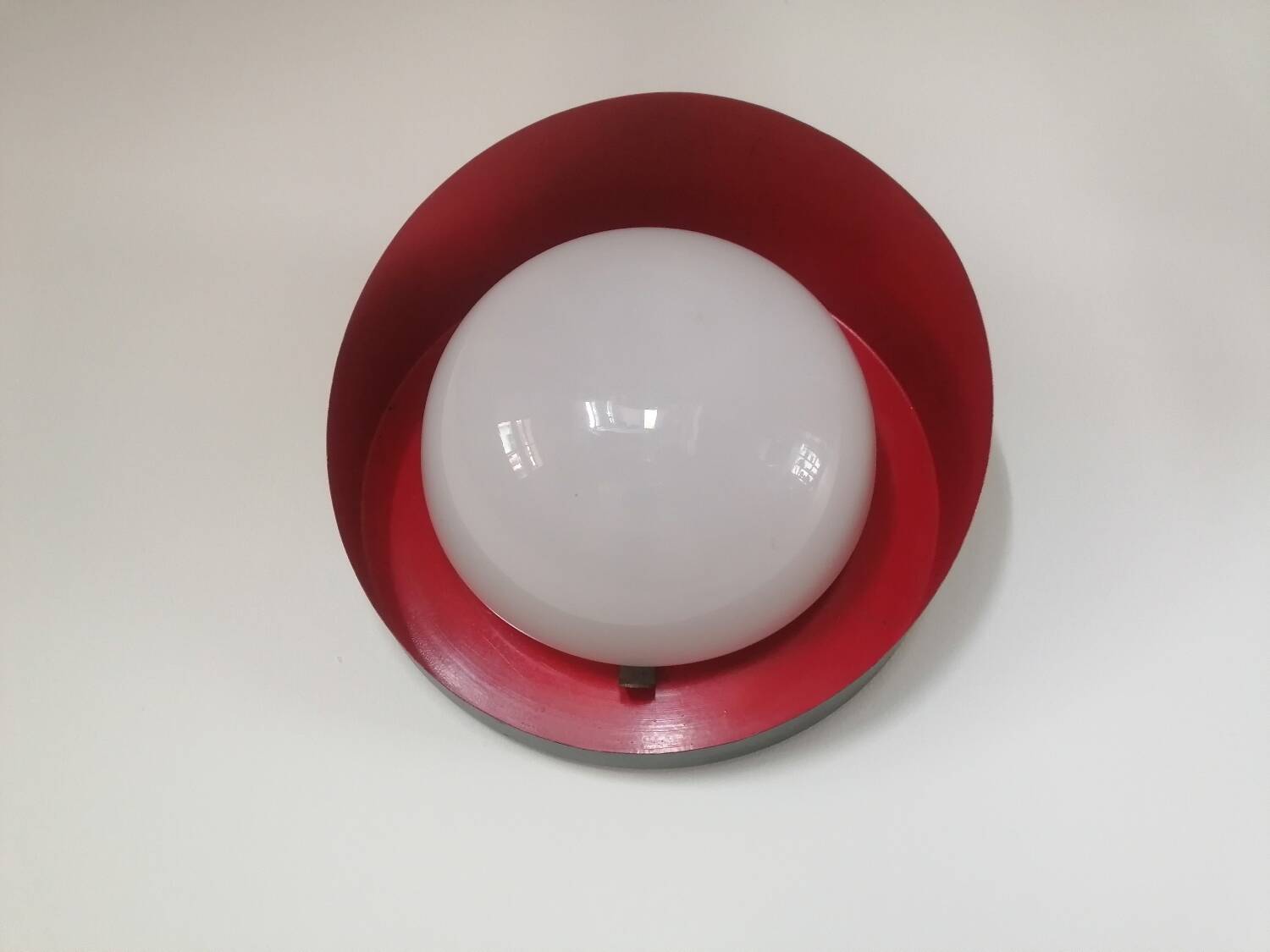 Metal wall light with glass globe