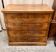 Antique English commode in flame walnut.