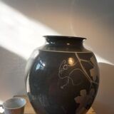 Black vase with plant decoration by Philippe Jacques