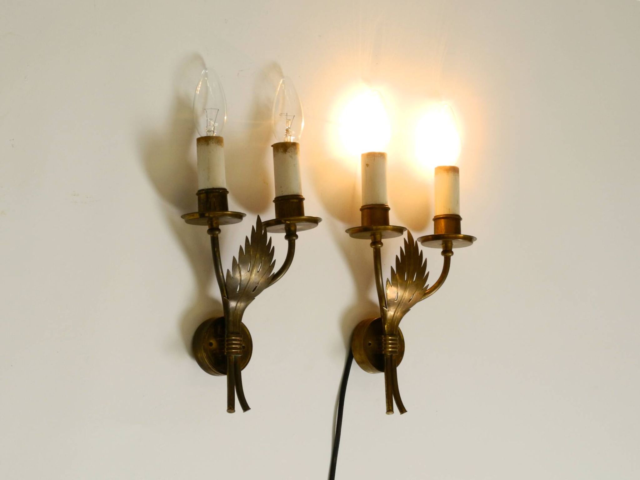 A pair of mid-century modern brass wall lamps by Vereinigte Werkstätten