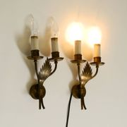 A pair of mid-century modern brass wall lamps by Vereinigte Werkstätten