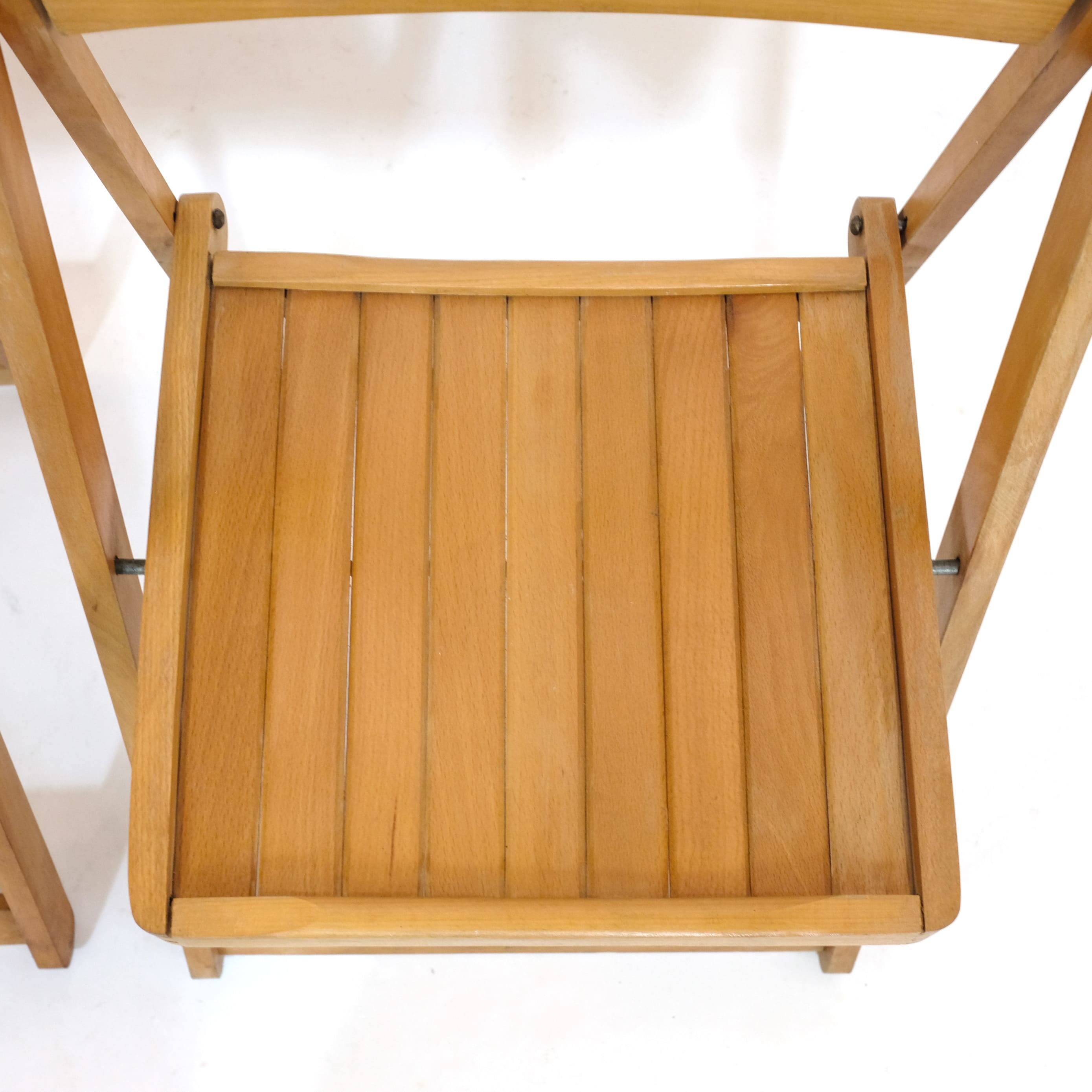 Pair of wooden folding chairs from the 80s.