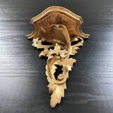 Golden console in rococo style