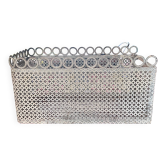 <perforated metal basket