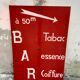 Tole sign painted "bar tobacco essence hairstyle"