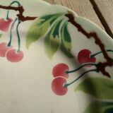 Old decorative plate in barbotine by luneville cherry motif