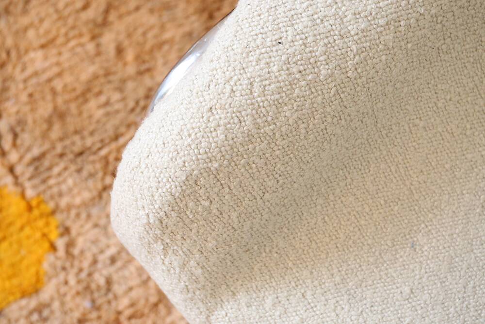 Armchair in ecru wool and stainless steel