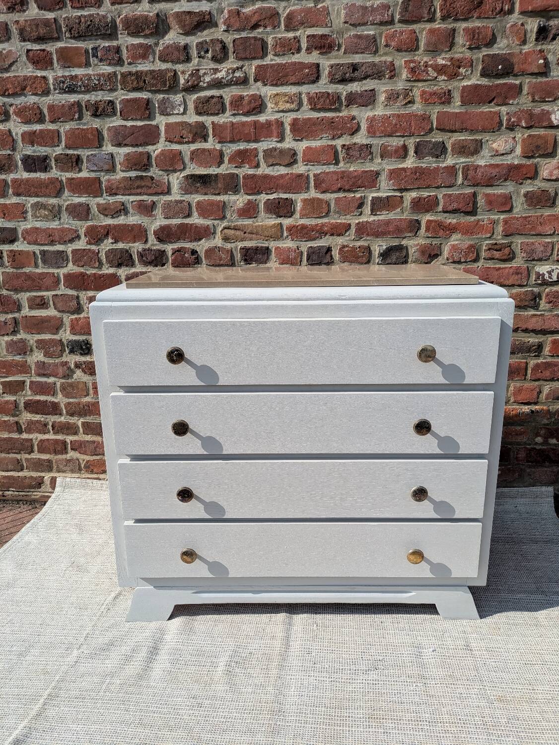 Marble-topped chest of drawers