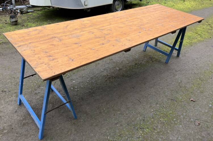 Farm wooden tavern table on trestles