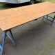 Farm wooden tavern table on trestles