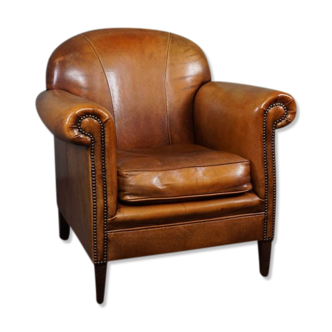 Fauteuil en cuir de mouton patiné