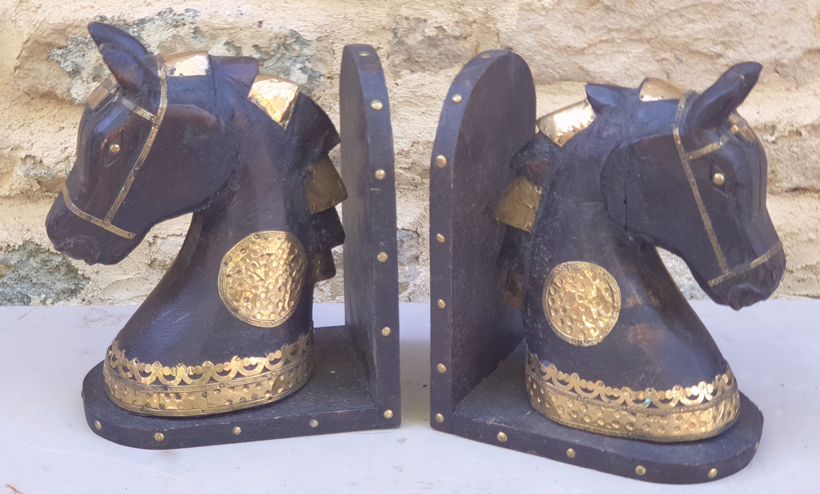 Horse bookbands in carved wood and brass