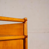 Small storage unit in cane and wood.