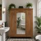 Art deco wardrobe in raw oak with bevelled mirror.
