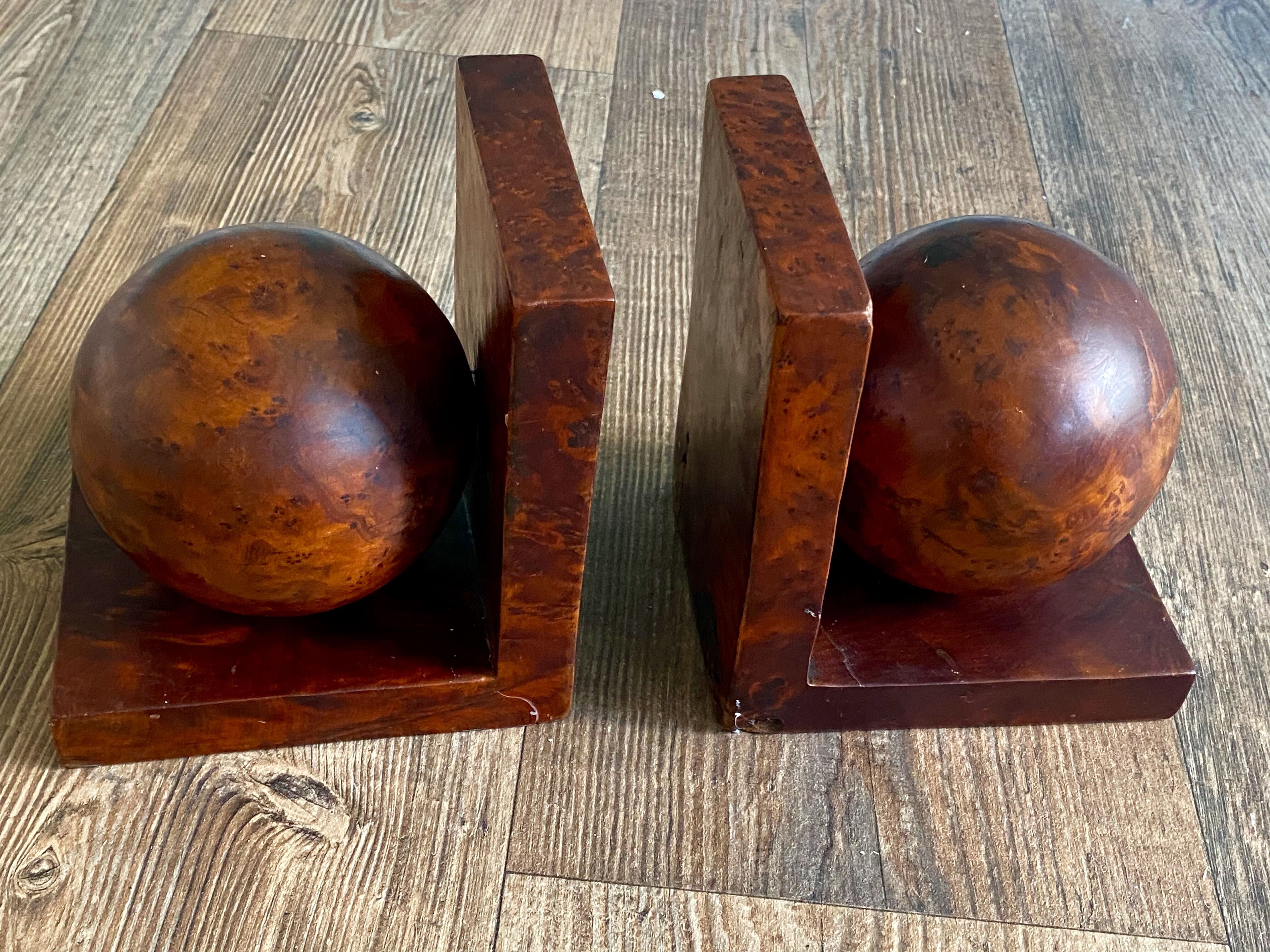 Pair of bookends adorned with spheres