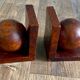 Pair of bookends adorned with spheres