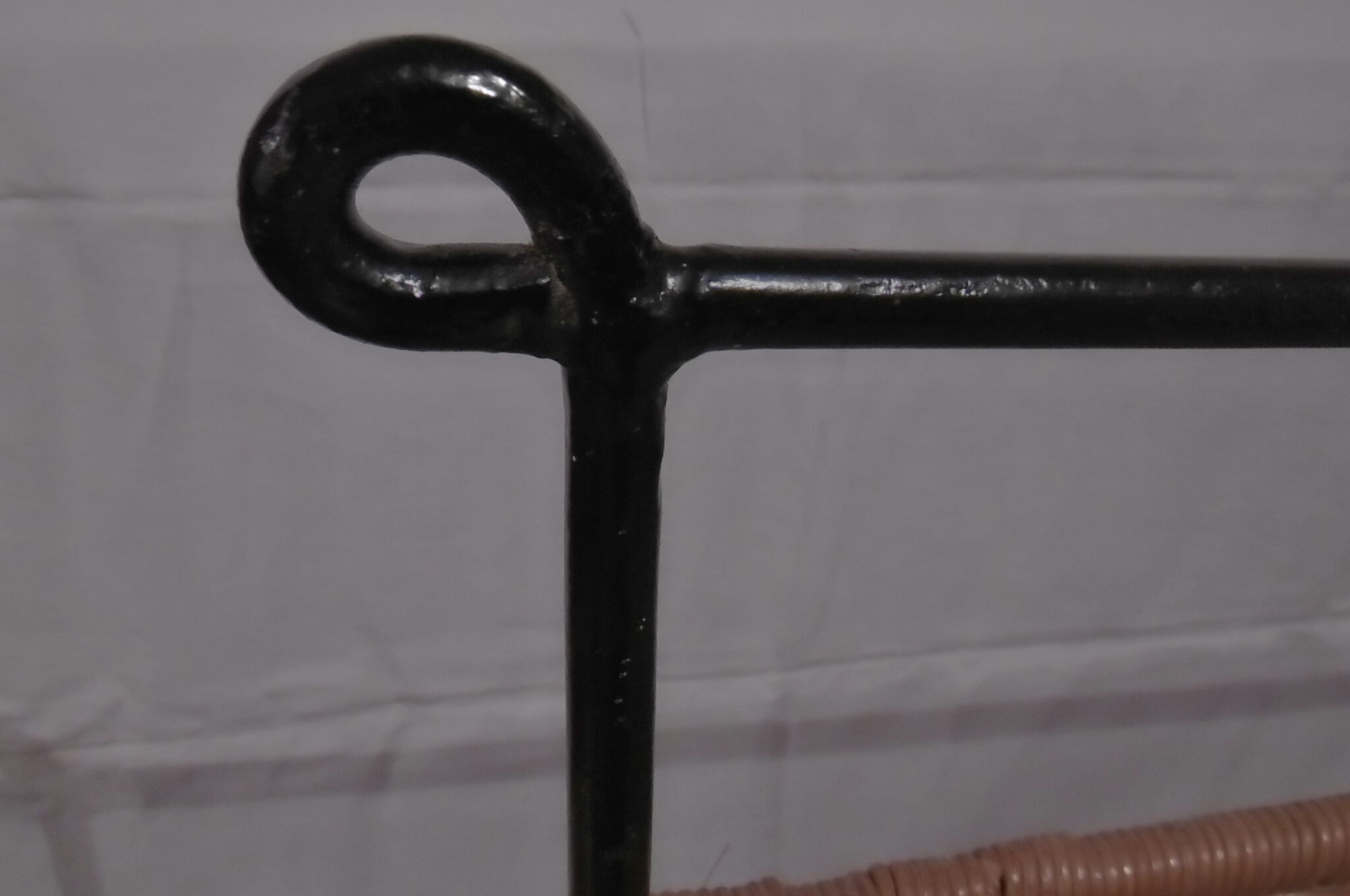 Black metal and rattan bed frame