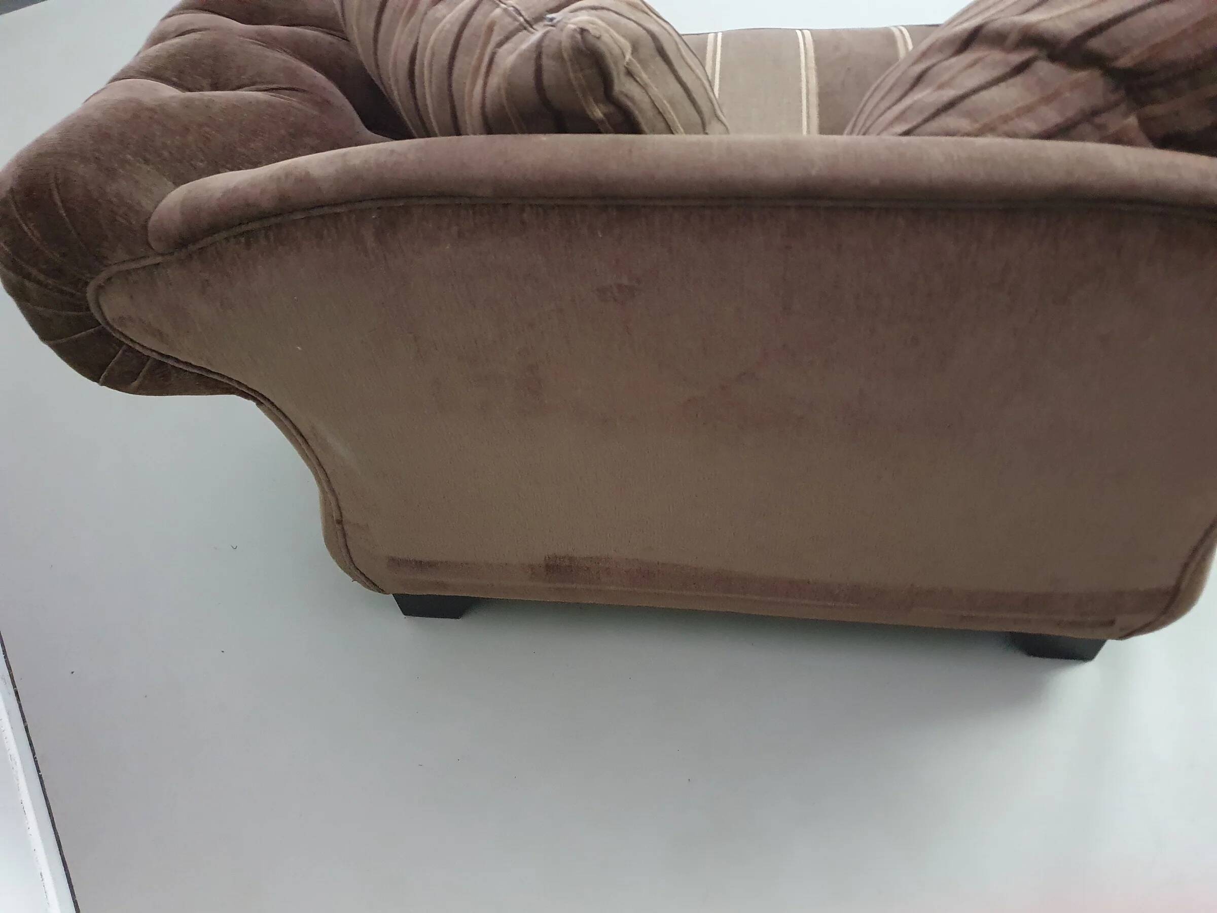 Large weighty love seat with the original matching cushions. Marked "Handmade in Holland"