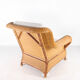 Large wicker armchair and its ottoman