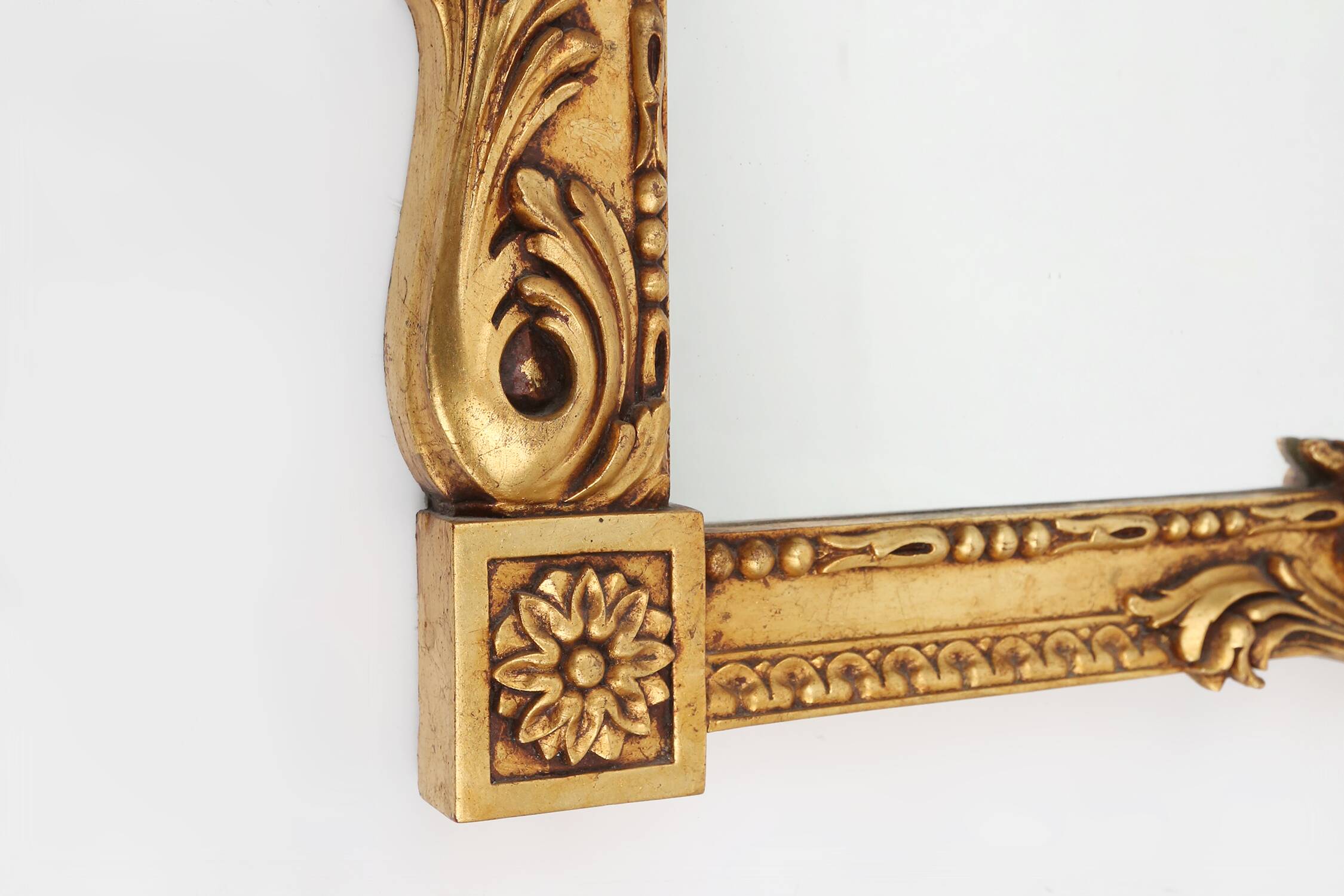 Highly decorated gilted carved wooden wall mirror, Belgium ca. 1950