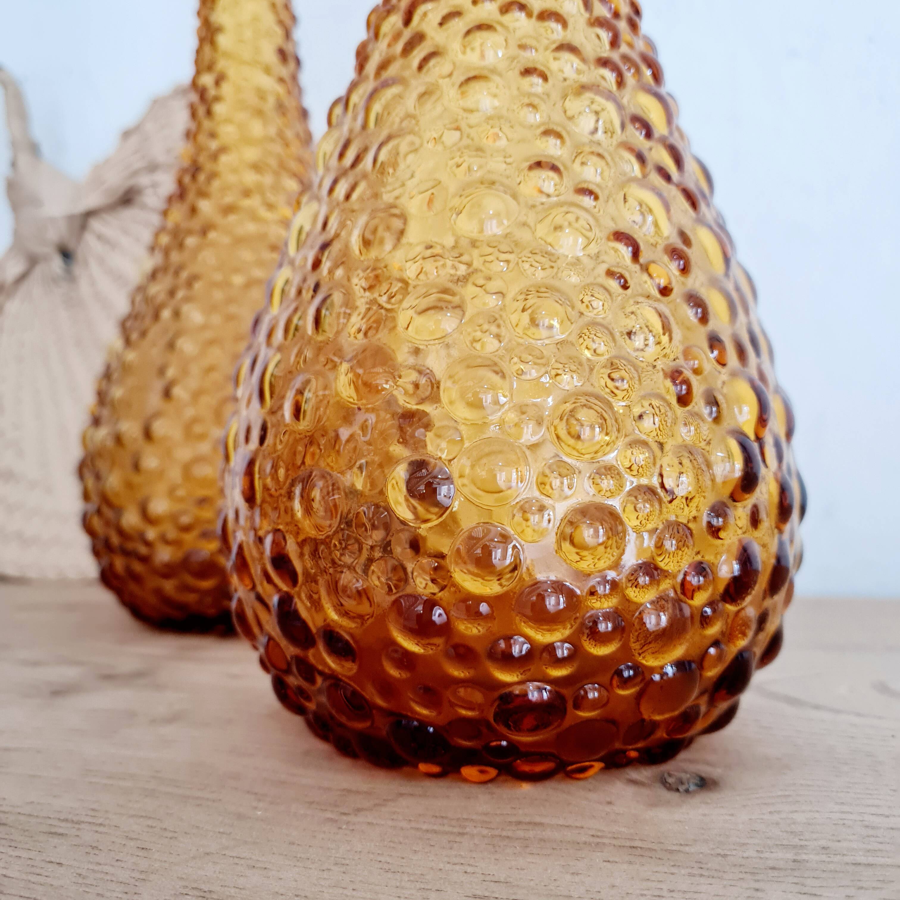 Pair of Italian Empoli vases in amber bubbled glass