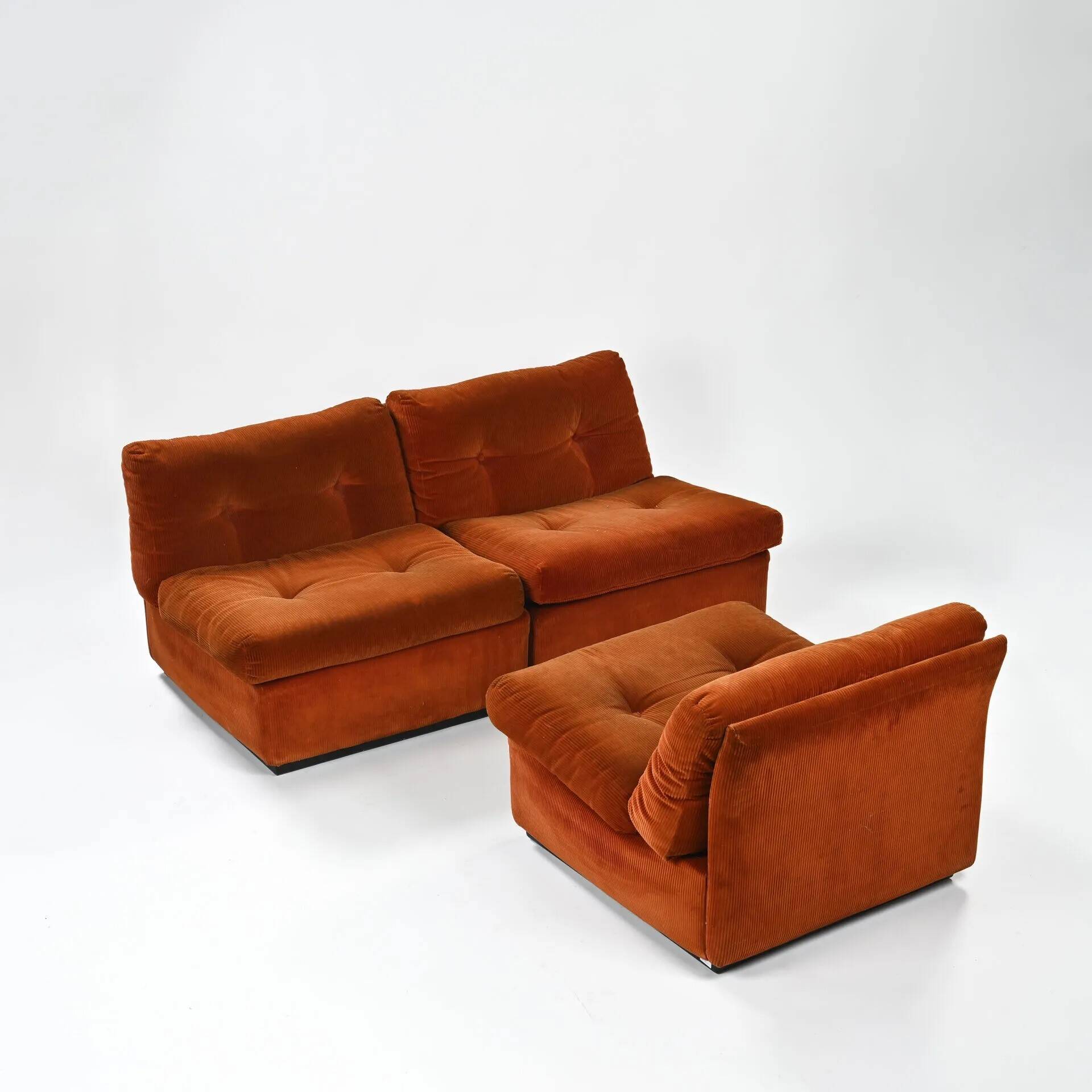 Set of three vintage armchairs. 1970s. Orange corduroy.