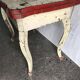 Rustic red and cream wooden dining table, moulded top, 1950s.