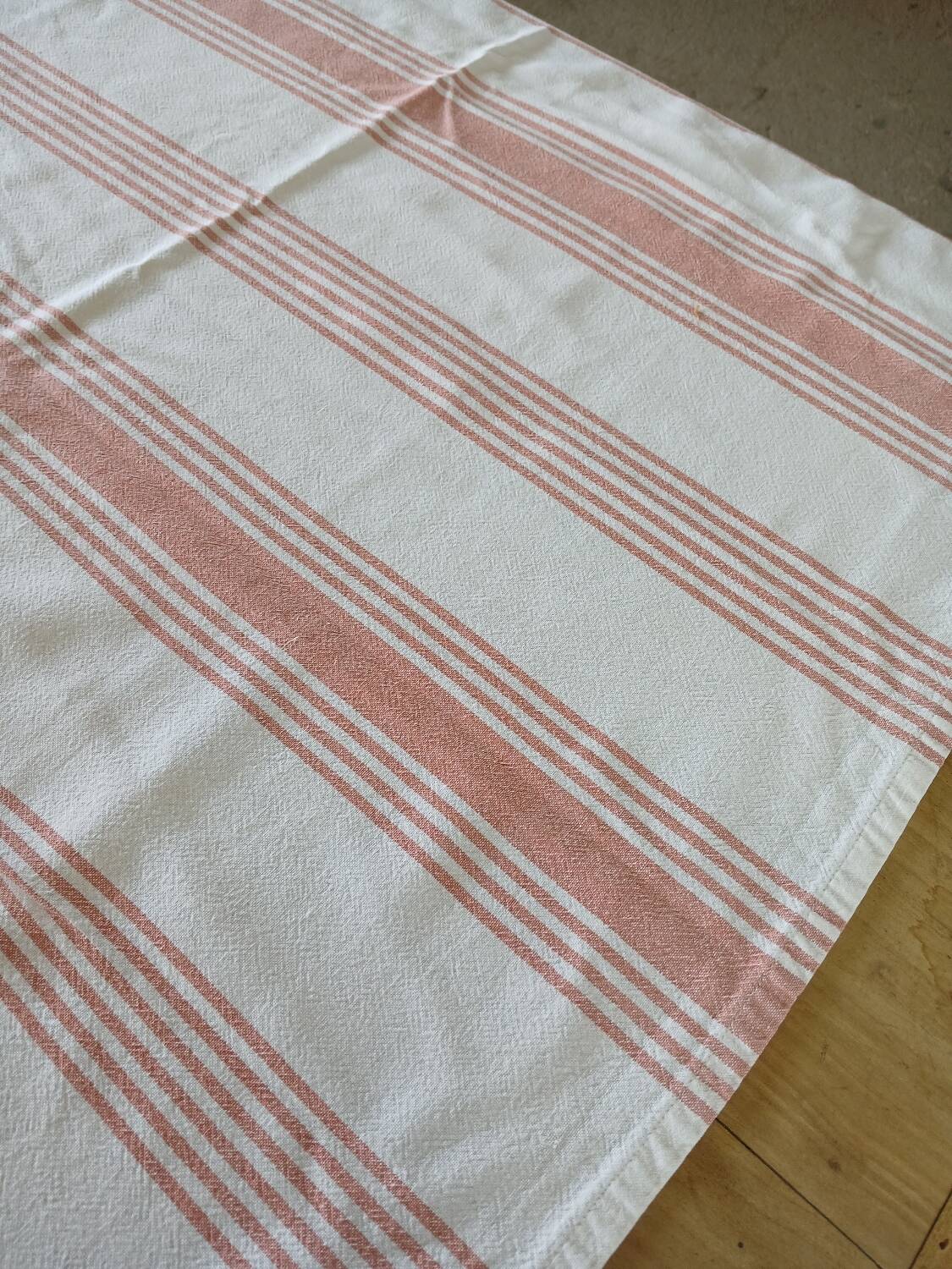 Old pink and white tablecloth