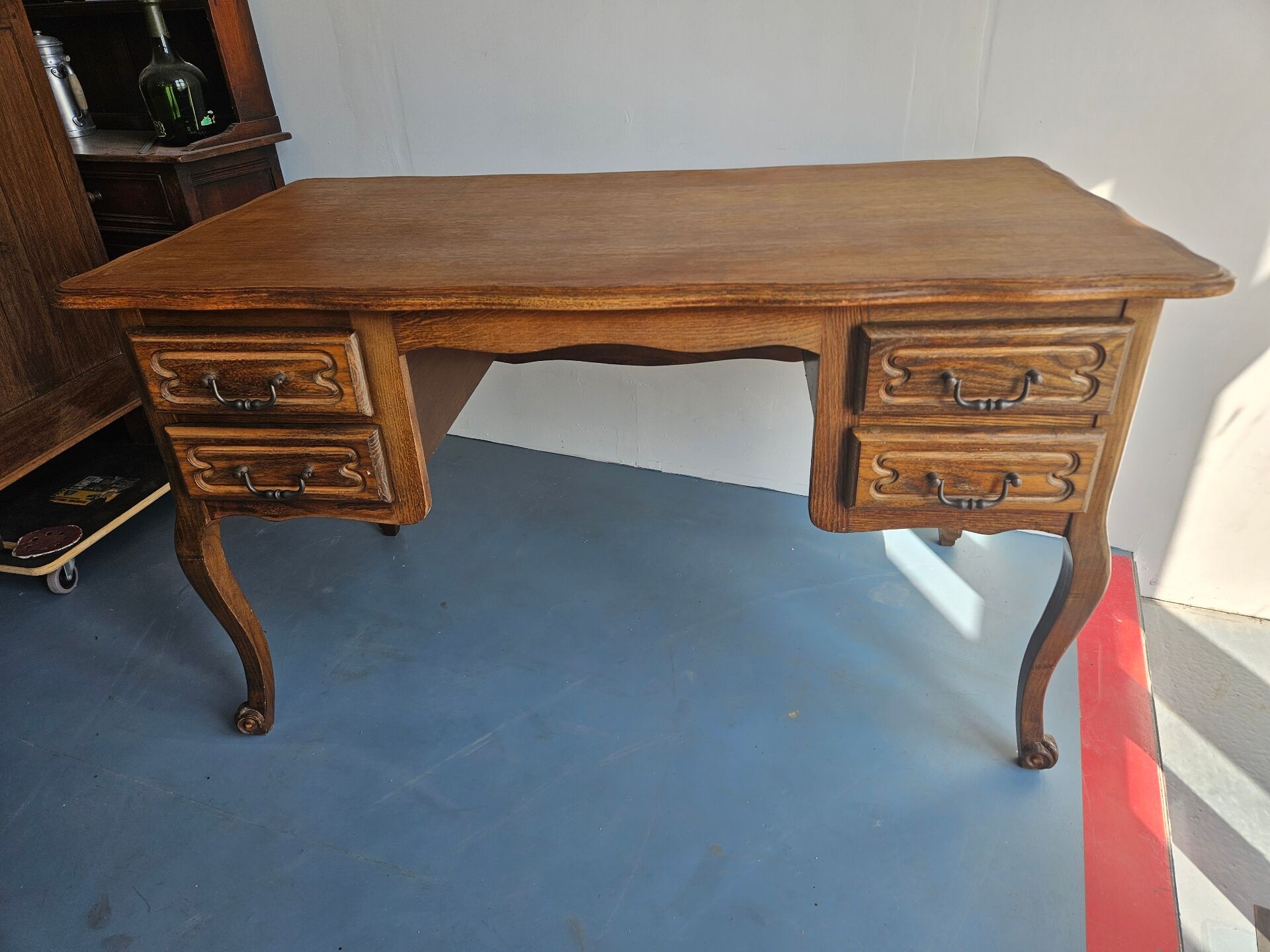 Antique wooden desk with 4 drawers.