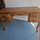 Antique wooden desk with 4 drawers.