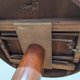 Round table with extendable central leg
