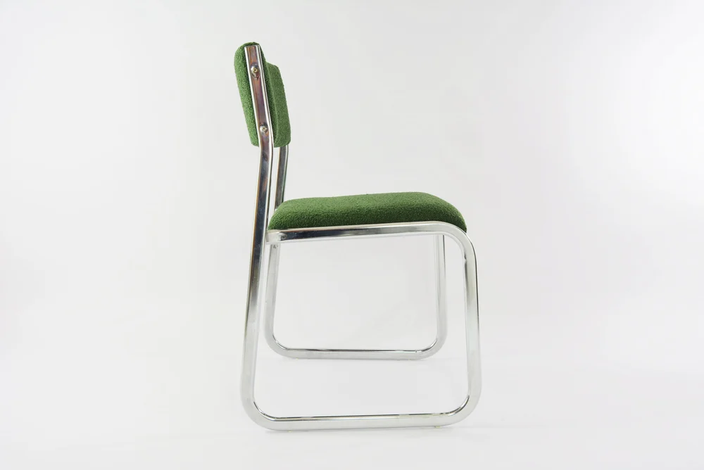 Chrome metal sled chair with green fabric