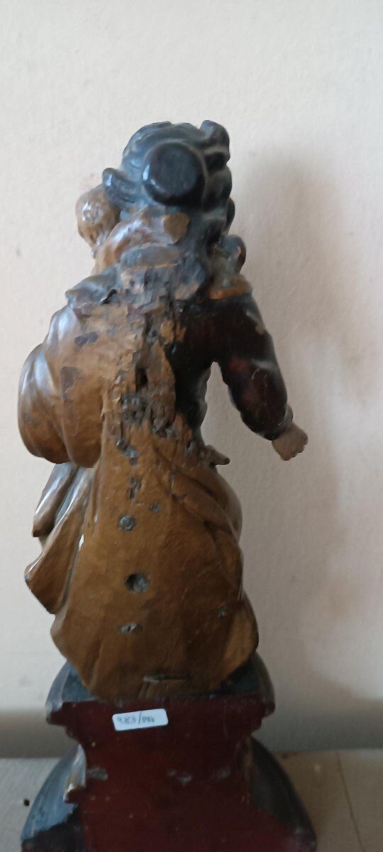 Ancient polychrome wooden sculpture representing the Virgin and Child, from