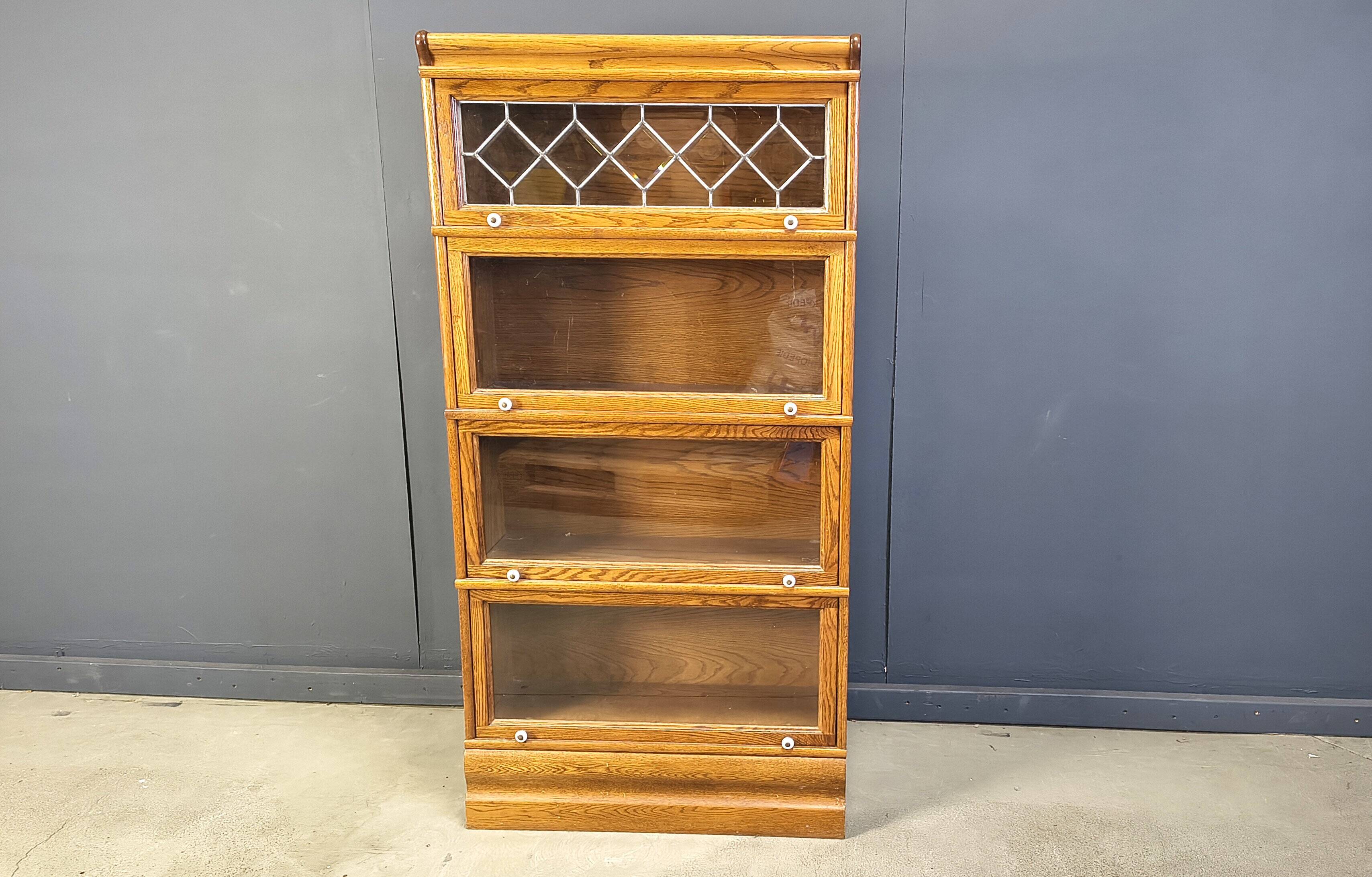 Four tier oak barrister style bookcase with leaded glass