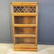 Four tier oak barrister style bookcase with leaded glass