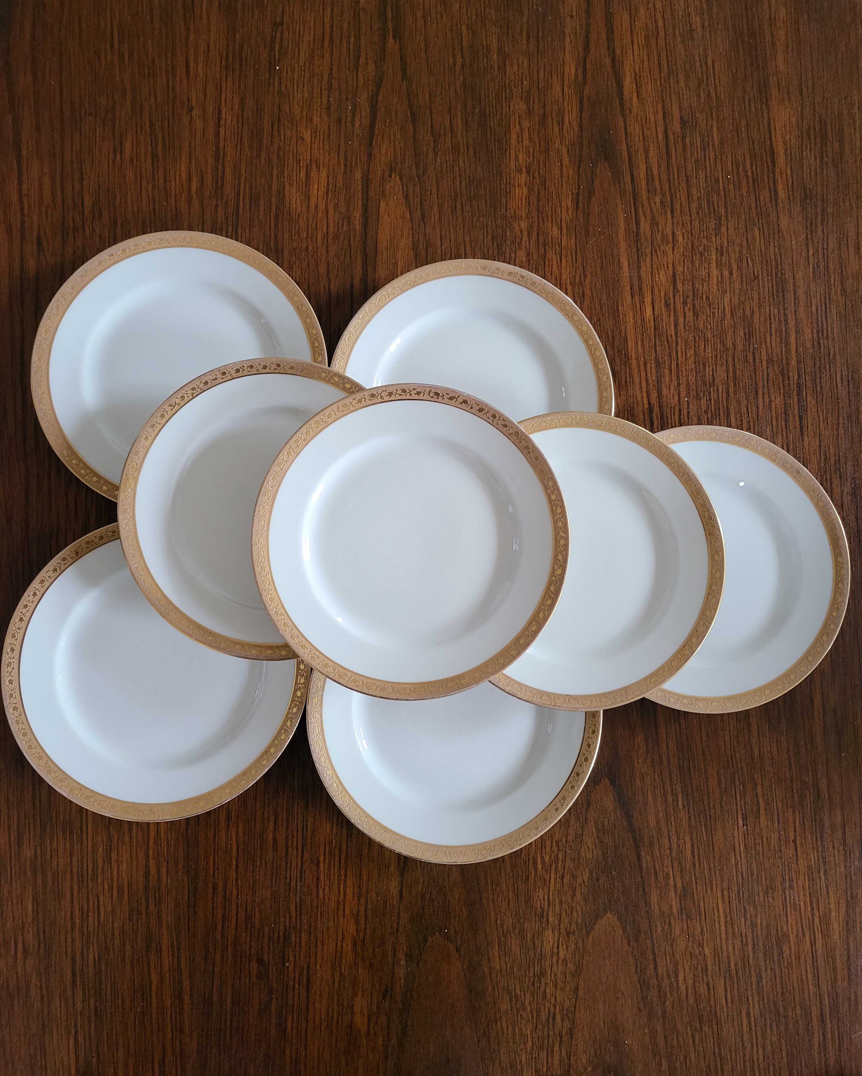 Lot of 8 small porcelain bread plates.
