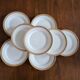 Lot of 8 small porcelain bread plates.