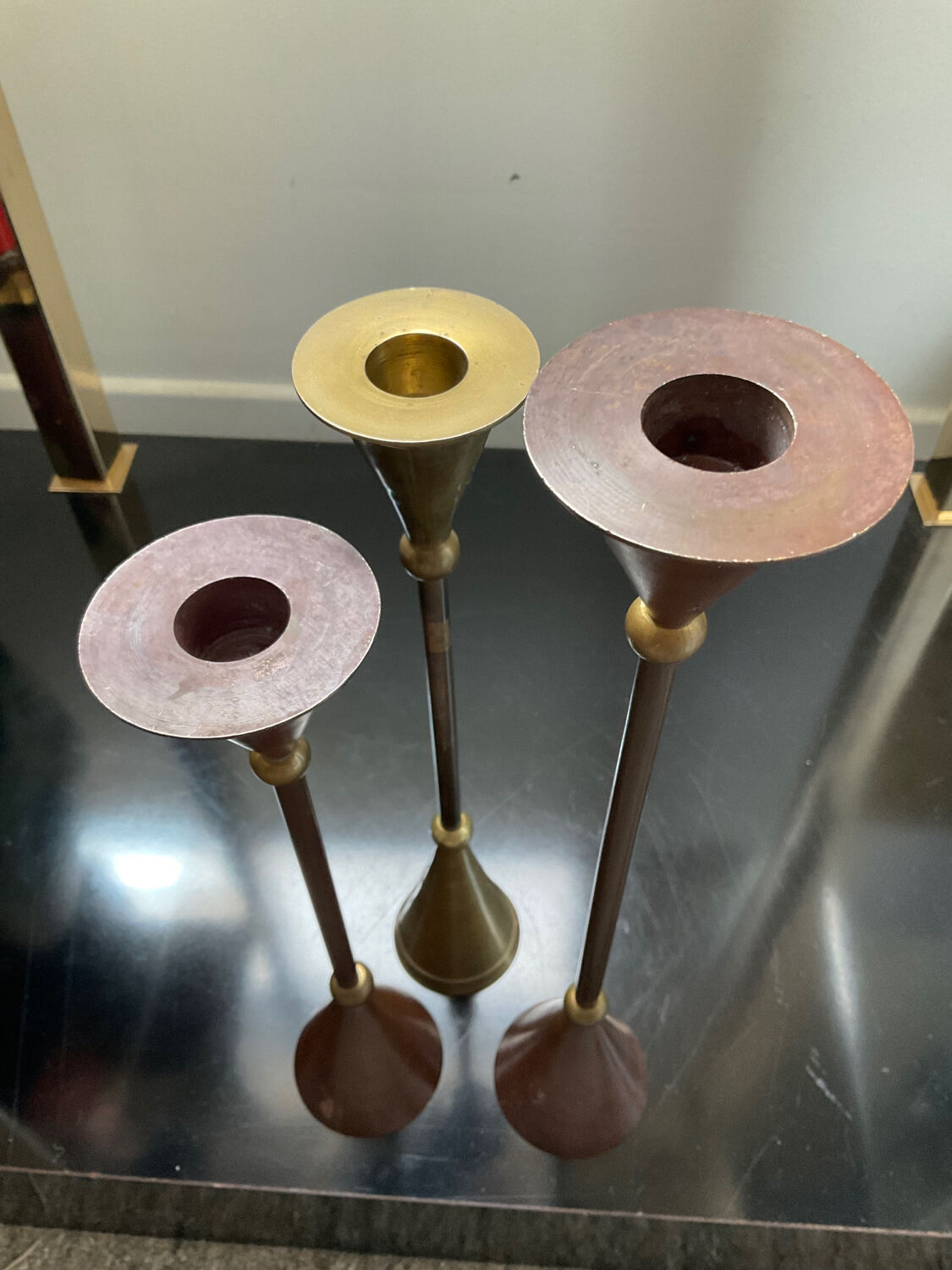 Trio of vintage brass and copper candle holders