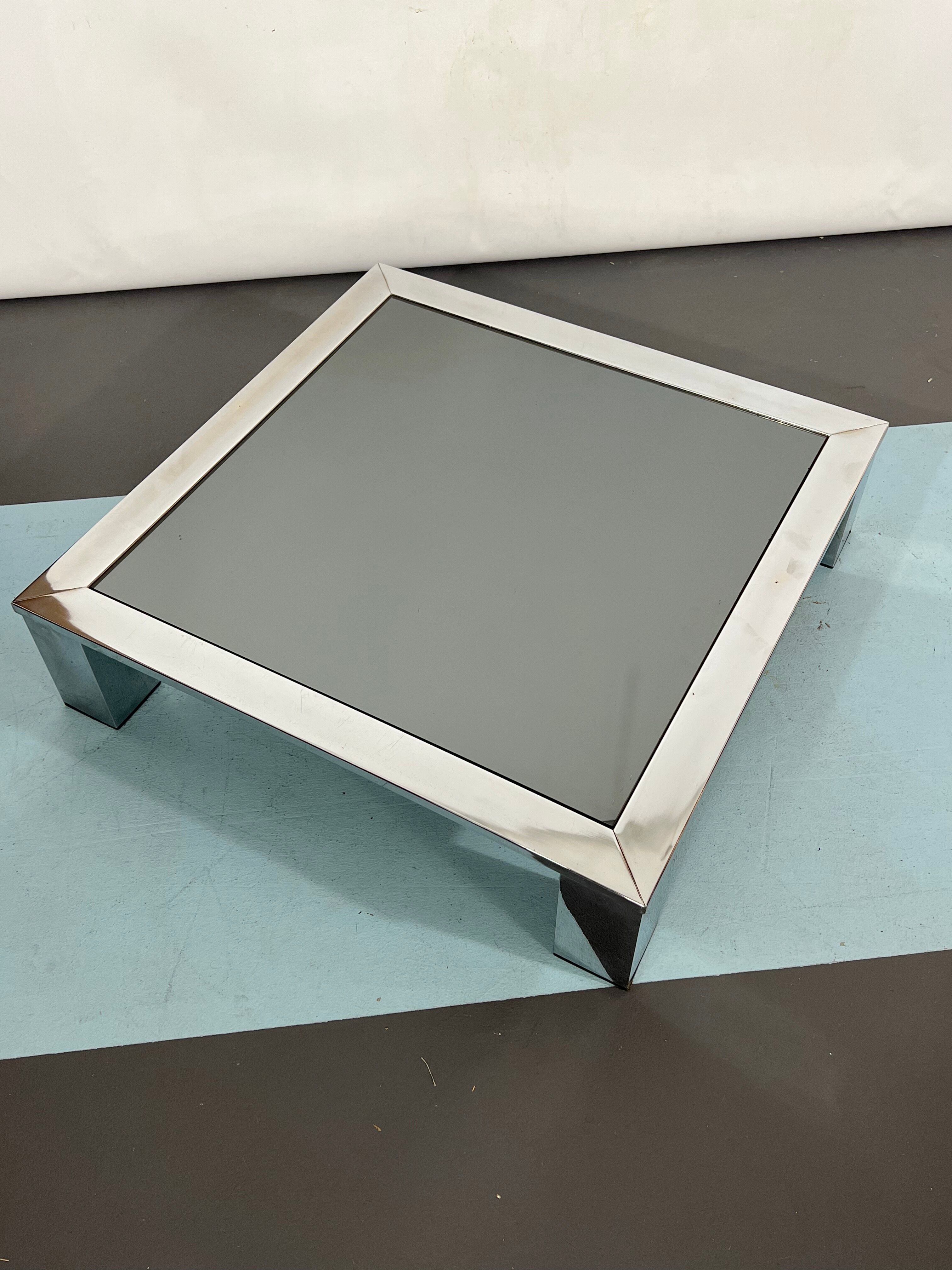 Mid-century chrome and dark mirror glass side table attributed to Saporiti. Italy 1970s