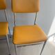 LM vintage chrome and orange/mustard yellow faux leather chairs